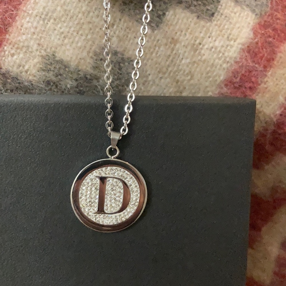 Pendant with the letter D. Size of a quarter..lobster claw lock with heart charm